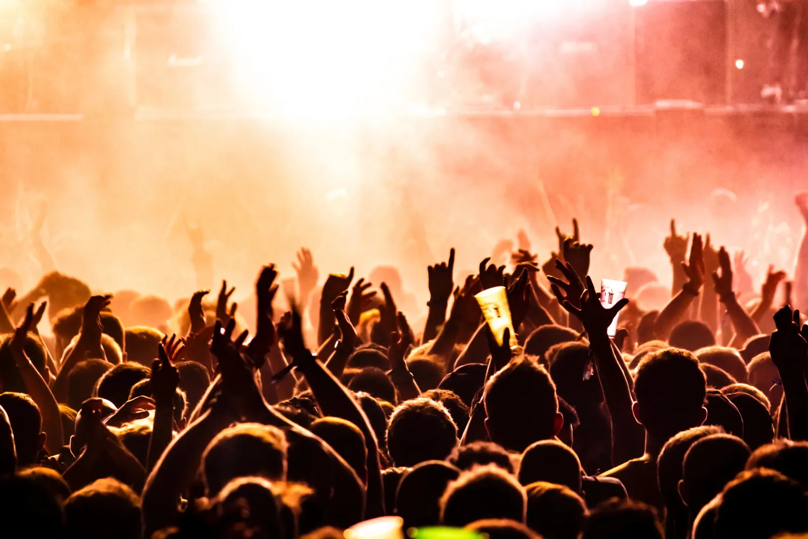 Country music concert at a packed outdoor amphitheatre
