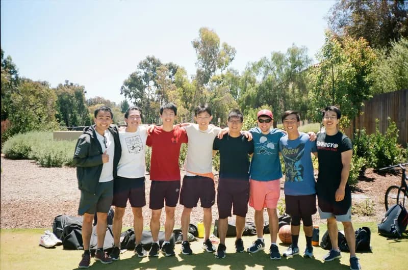 A group of young men standing next to each other